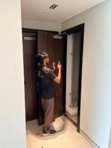 The Snag Master engineer documenting an electrical room during a building inspection in Dubai