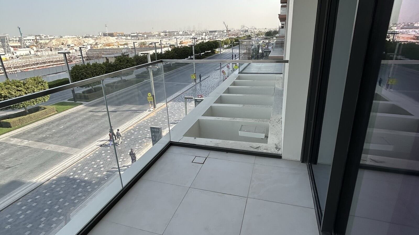 Balcony drainage and threshold inspection during a Dubai apartment snagging survey